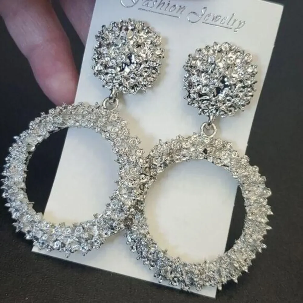 Silver tone circular themed statement earrings texture chunky
